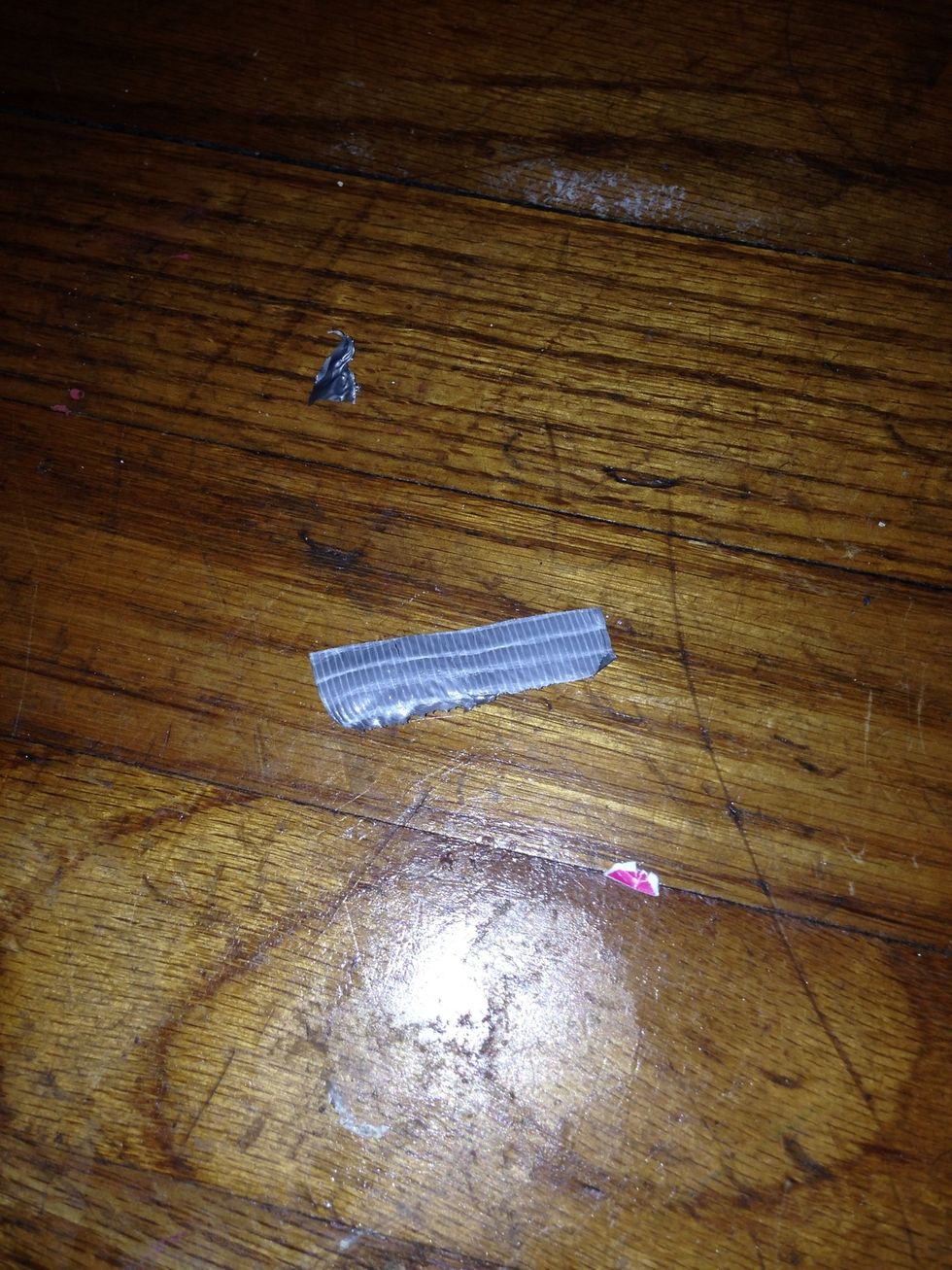Now cut a little piece of tape and put it where the folds are