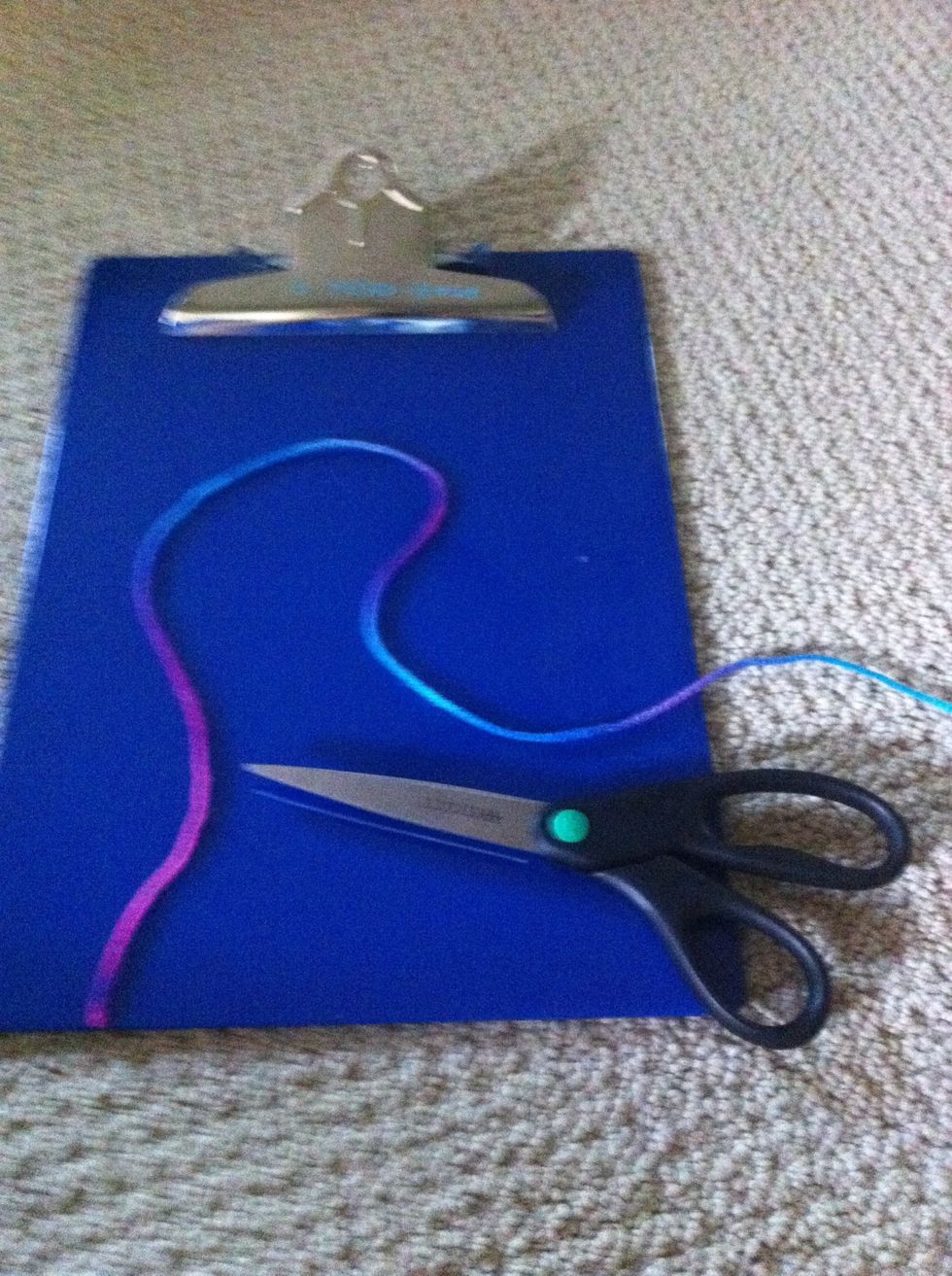 Now cut a piece of yarn about 24 in. Long