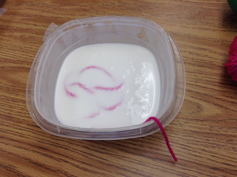 Now, cut a piece of yarn to about 12in. Or more and put it In glue mixture of water and liquid glue.