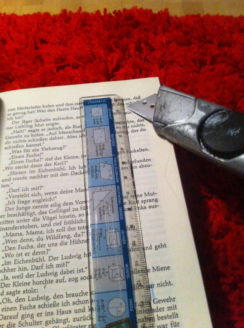 Now cut along your lines. To make the lines straight use a ruler. Depending on the thickness of the paper you'll be able to cut about ten pages at once.