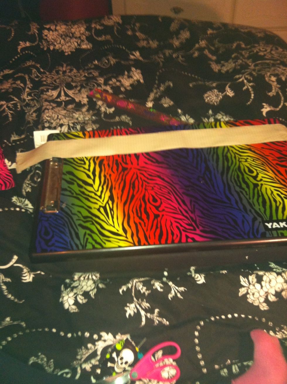 Now cut another piece of tape about 18" long and place it on your surface stick side up. Then cut another piece the same size 18" and place it on top of the other stick side to sticky side.