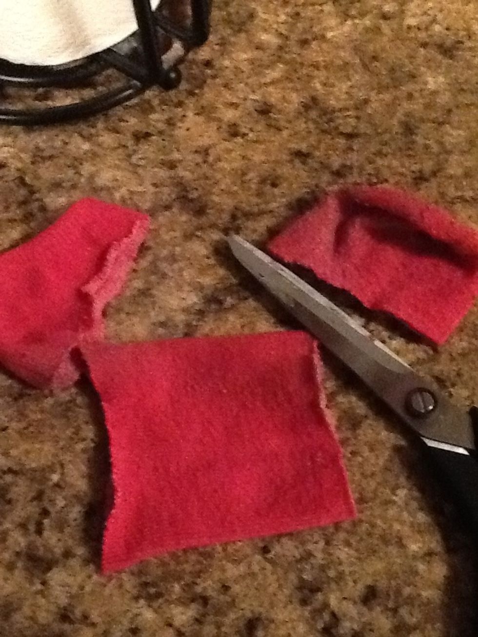 Now cut both ends off, leaving enough of the sock left to pinch in the middle.