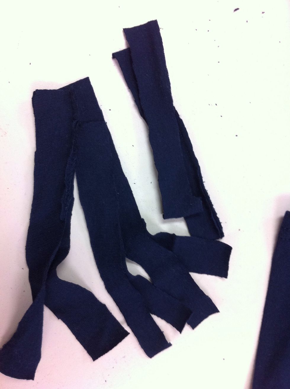 Now cut each strip into hand-width sections. I got 8 sections from one strip of an XL shirt.