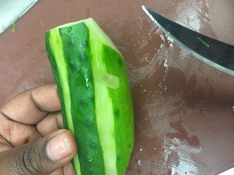 Now cut four small slitted holes on each side of the cucumber.