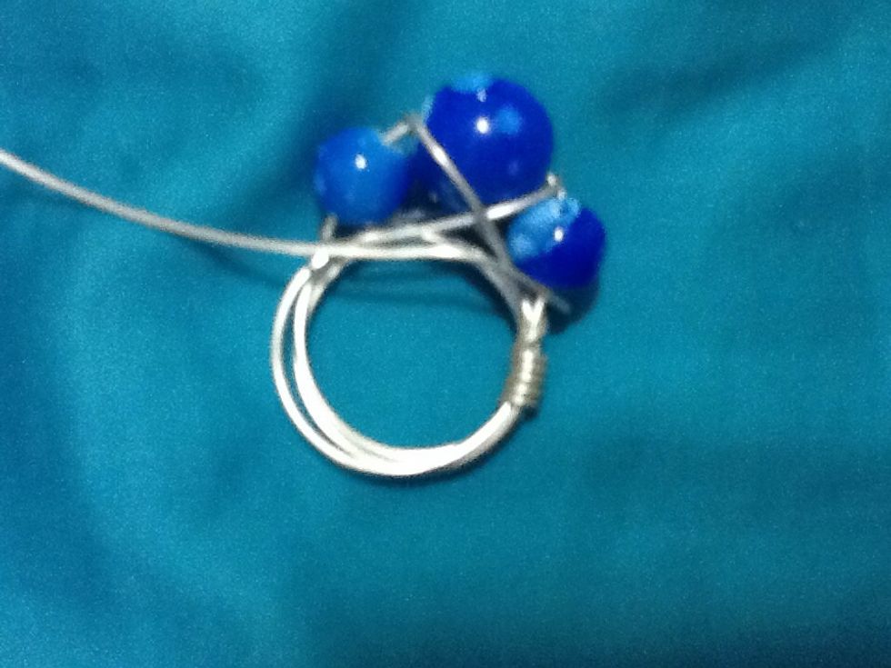Now cut of the extra and tuck the nub to the backside of the ring