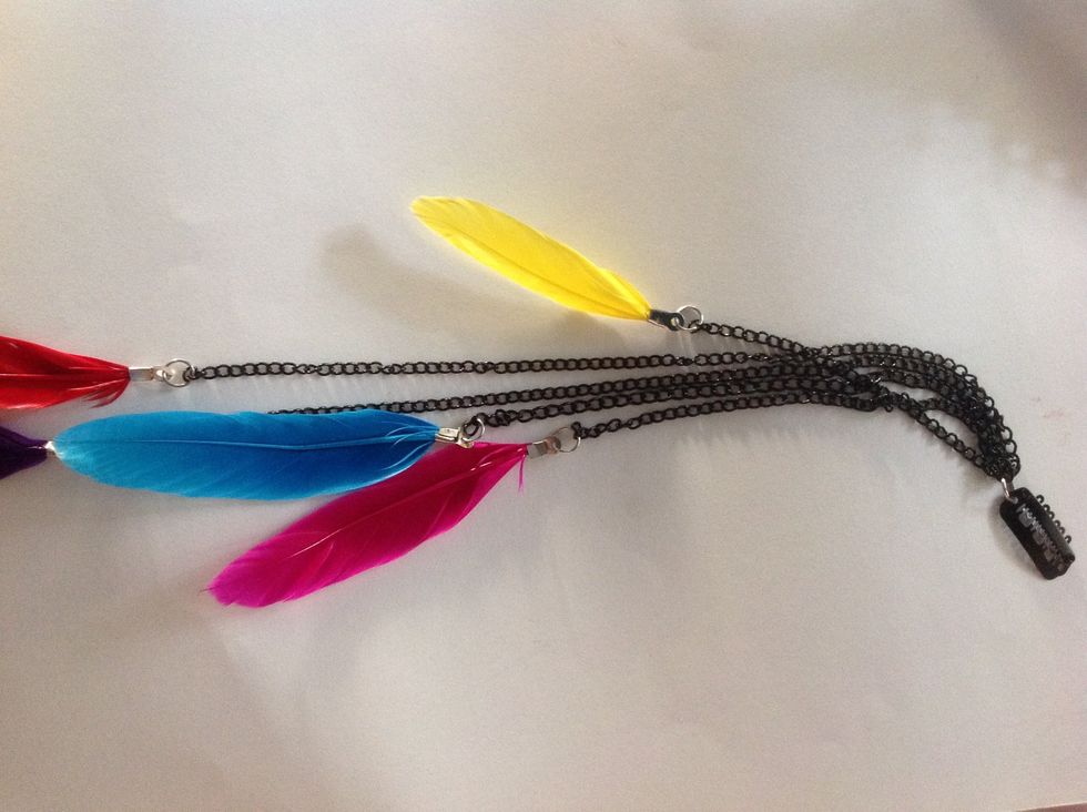 Now cut the chain into various lengths. I've got 5 different lengths. Then attach all the feathers to the chains using jump rings.