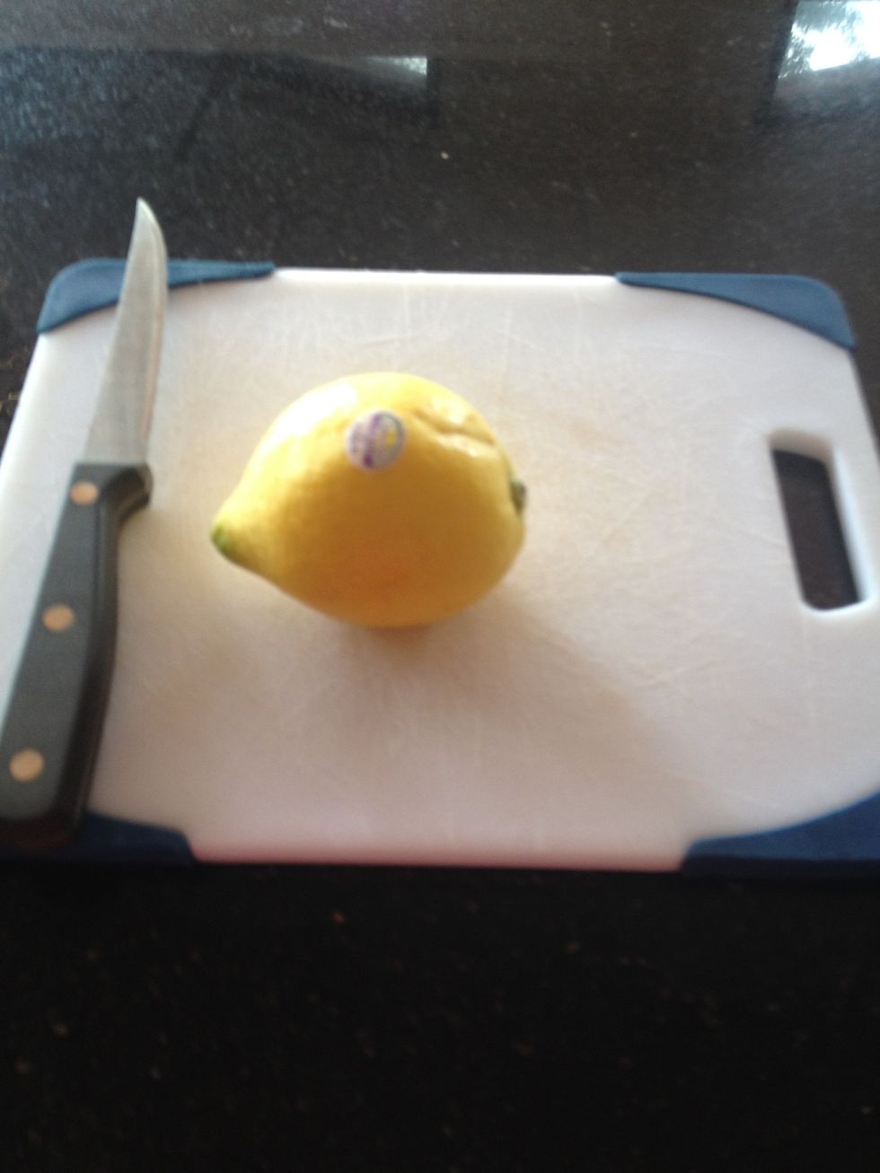 Now cut the lemon in half.