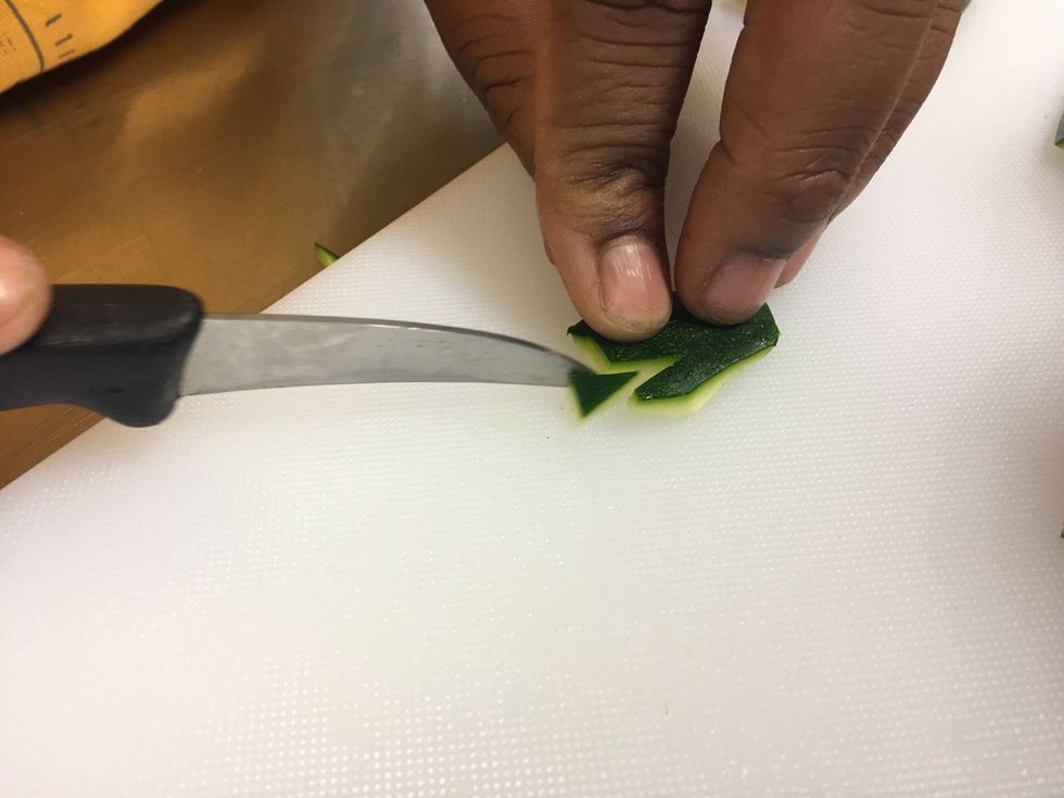 Now cut triangles on the shorter side, all down that side.