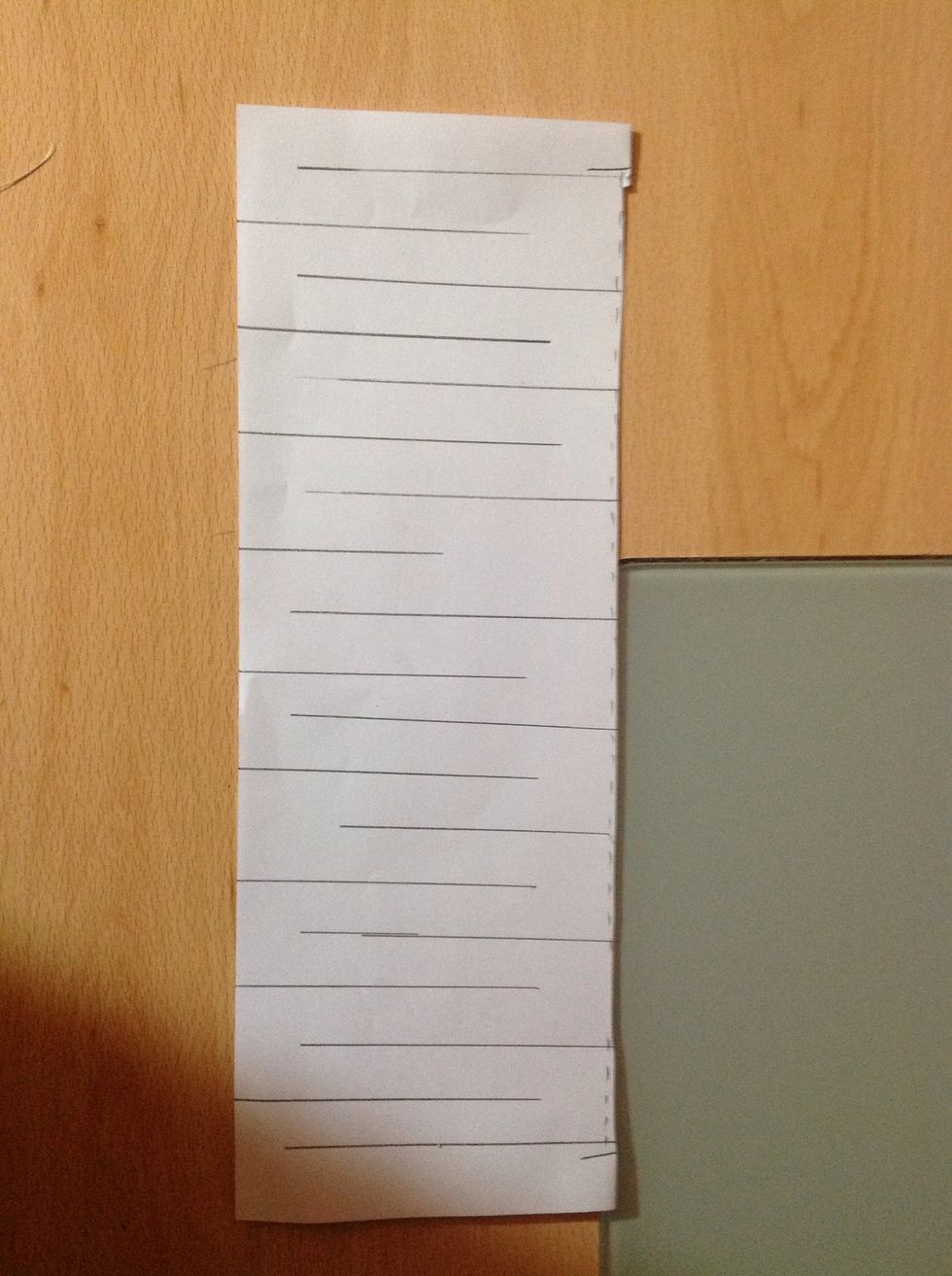 Now cut where I have drawn the lines... Start from where you cut along the folded paper, and cut from alternative sides.... But you MUST leave 1 to 2 cm at the end of each cut.