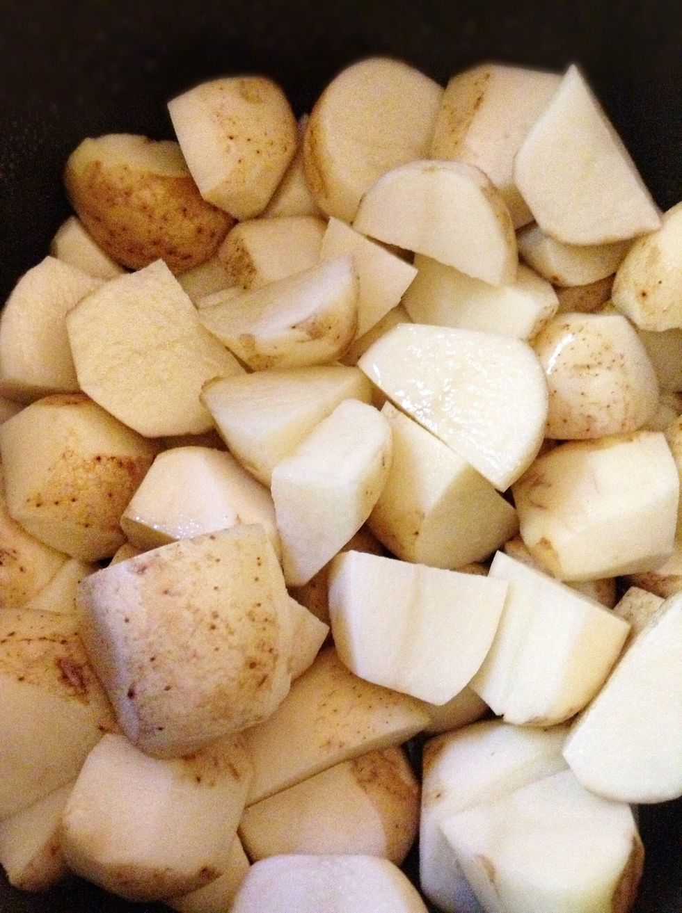Now cut your potatoes in half. Sometimes if they are too big you might have to cut them more. Just try your best to make them about the same size as the rest of the potatoes.