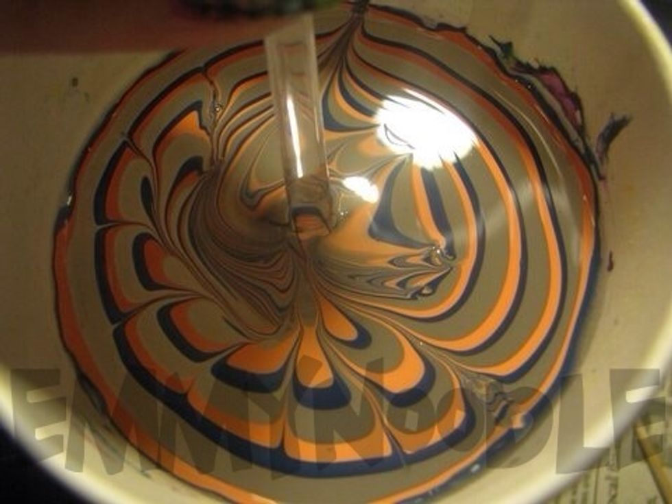 Now dip your nail into the water in whichever place you feel your design looks best.