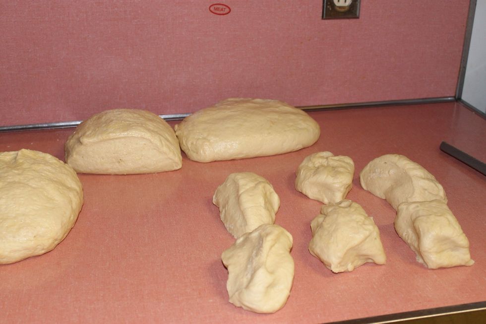 Now divide 1 of the dough portions into 6 equal parts
