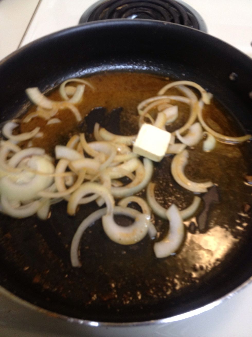 Now divide your onions and place them into your pan. Ads more butter if needed so the onions would stick to bottom of pan. Occasionally stir.