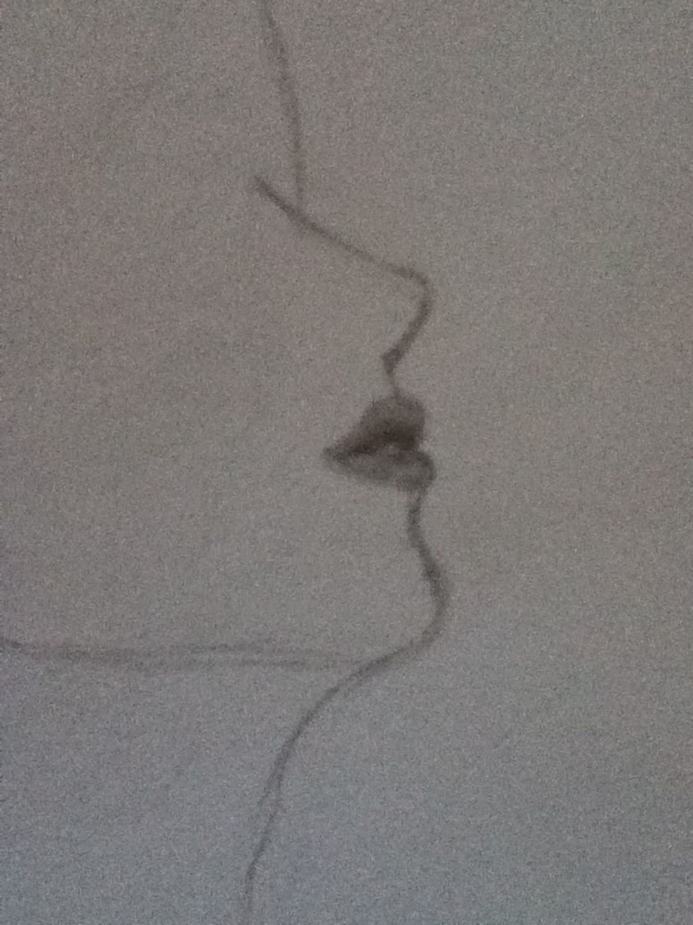 Now do the lips, darker towards the middle and leave a white spot as a tooth.