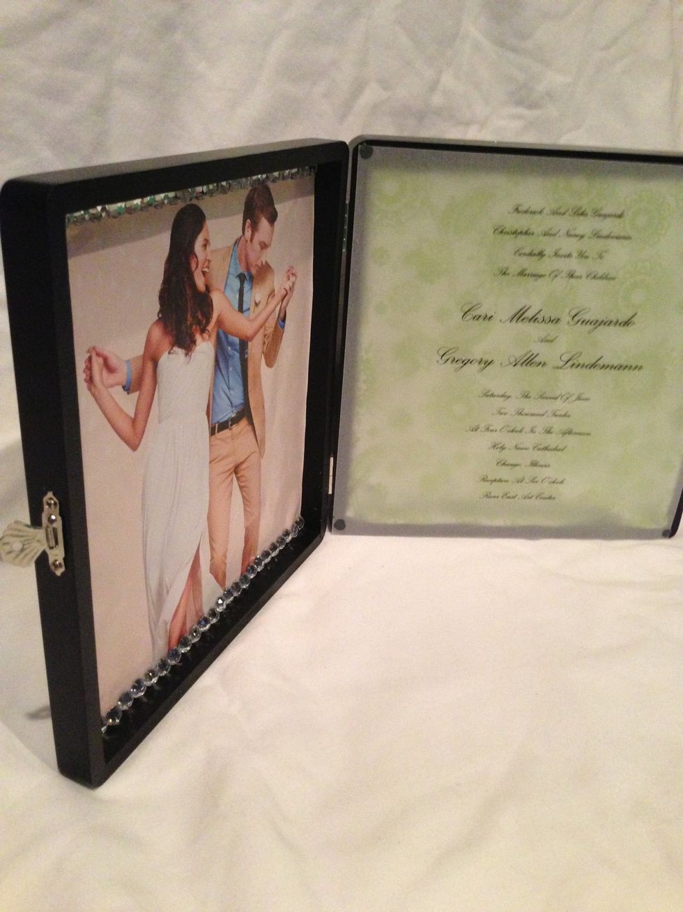 Now do the same to the right side with a piece of scrapbook paper. I chose a decorative page that went with my wedding colors. Trim your paper and place in box with glue dots on all four corners.