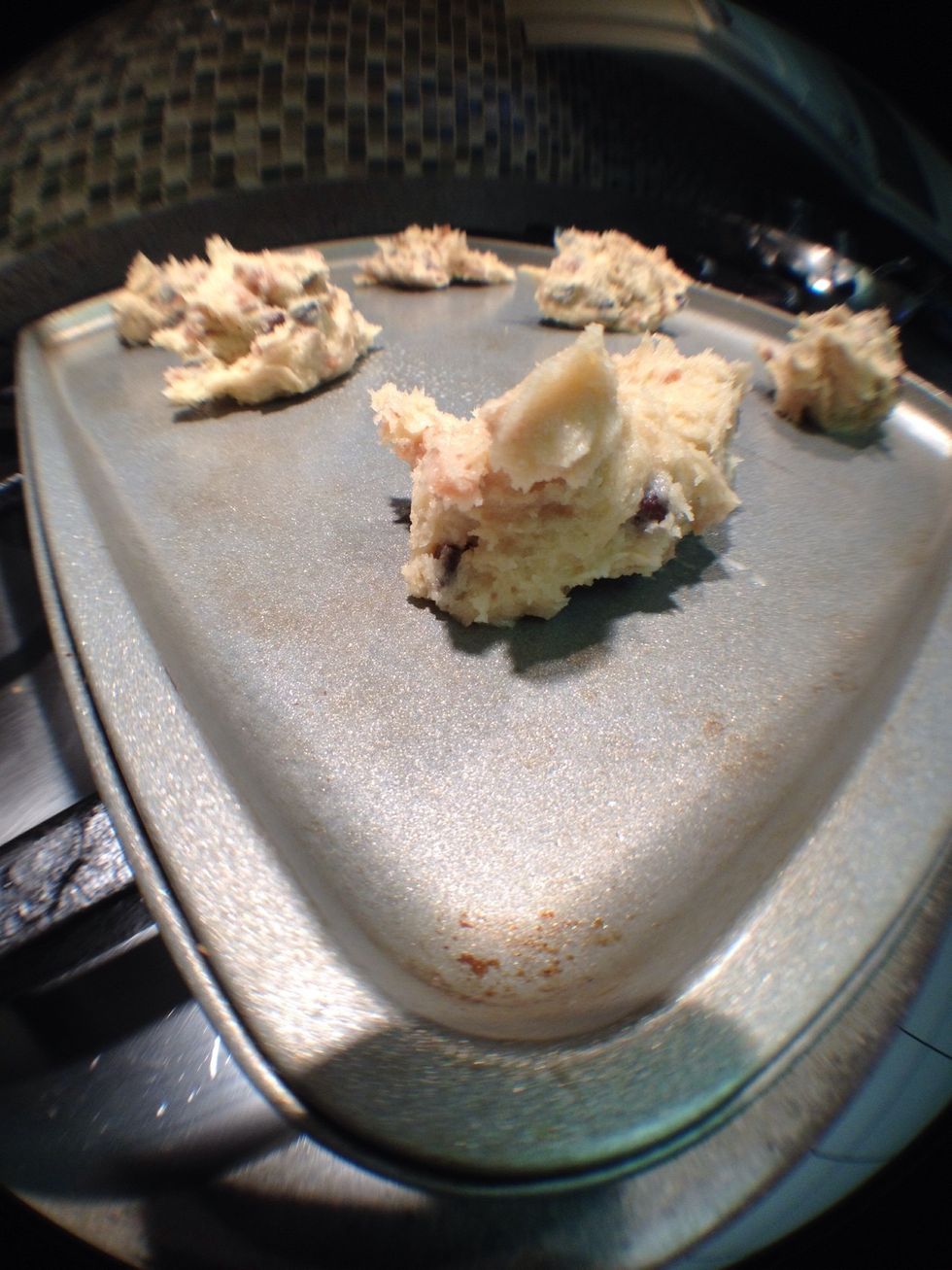 Now do the usual cookie thing. Spoon about a table spoon of batter onto a greased cookie sheet. Leave lots of room. These sum*itches like to spread out!