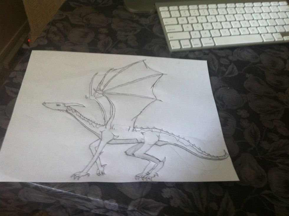 Now do the wings and the claws and this is what is should look like ( in pencil ) and if u want to bolden it in pen like in the next step ( optional )