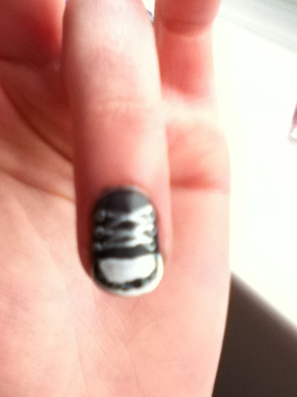 Now draw a black curve round the end of the nail.