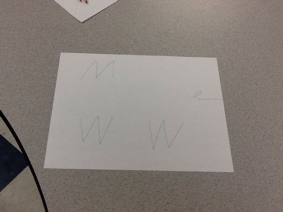 Now draw a cursive E.