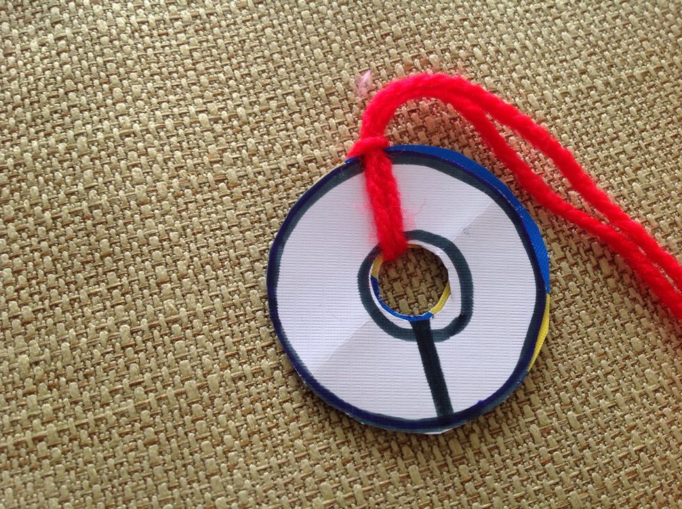 Now, draw a line directly across the knot you made.