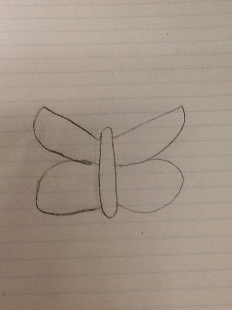 Now draw a long skinny oval in between the wings.