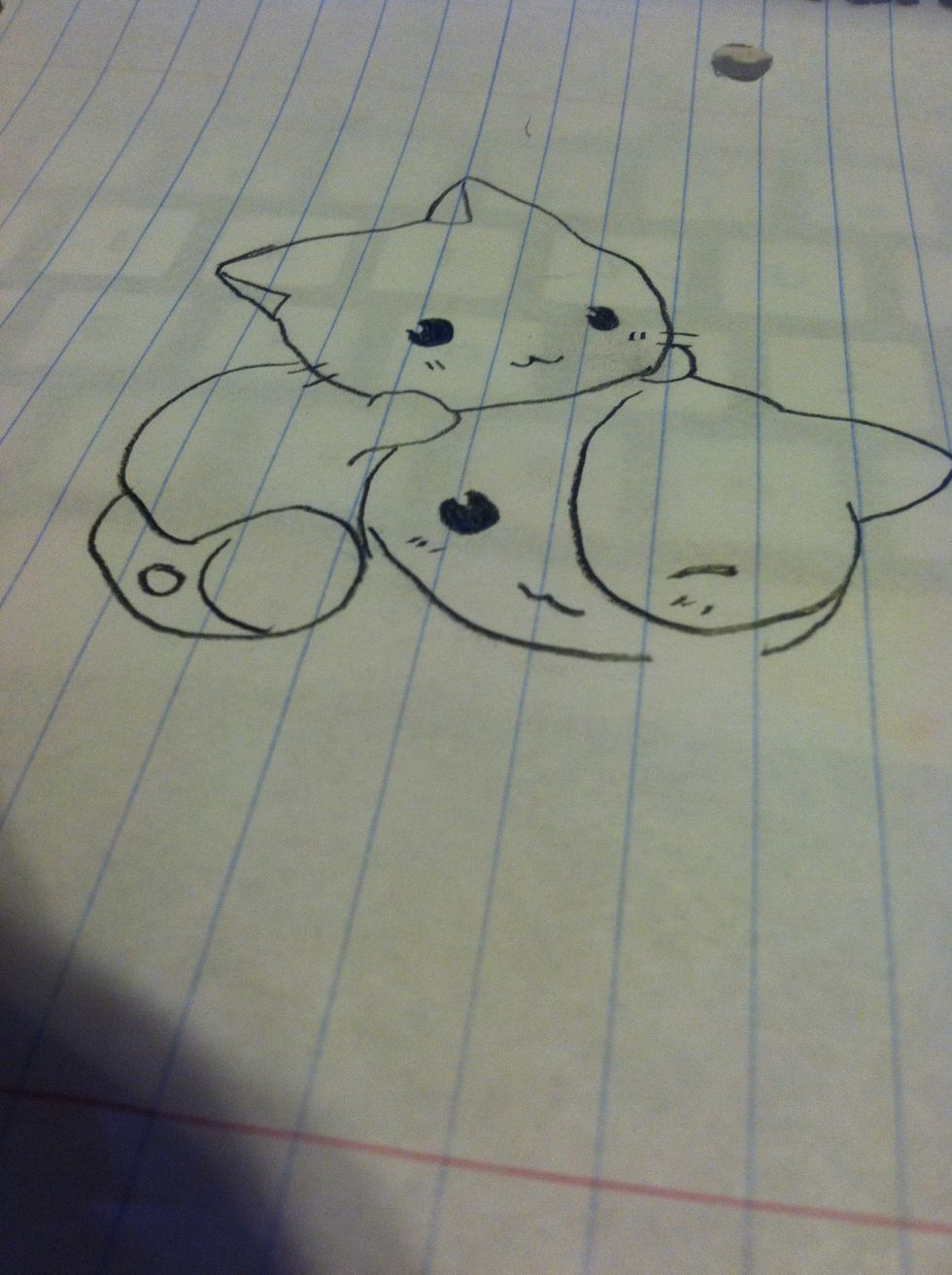 Now draw the eyes, nose, spot and lines on the cats head.