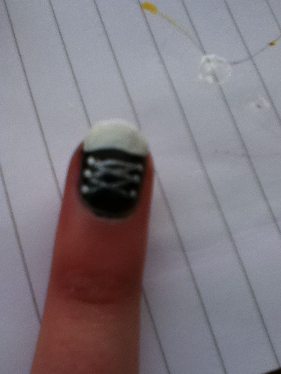 Now draw the laces across using the white and a pencil again.