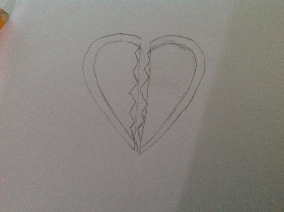 Now draw these broken pieces of the two heart halves.