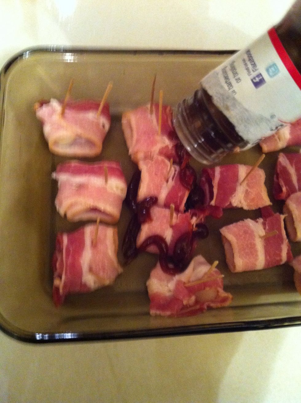 Now drizzle the BBQ sauce over the bacon and water chestnuts.