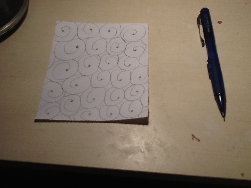 Now fill in the small circles on the spirals.