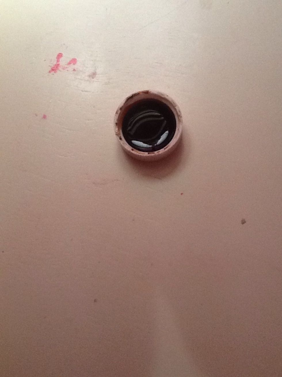 Now fill up a cap full of your scented extract ( I'm using vanilla ) keep in mind if your using a bigger cup then you will need 2 or 3 capfuls depending on how strong you want your smell.