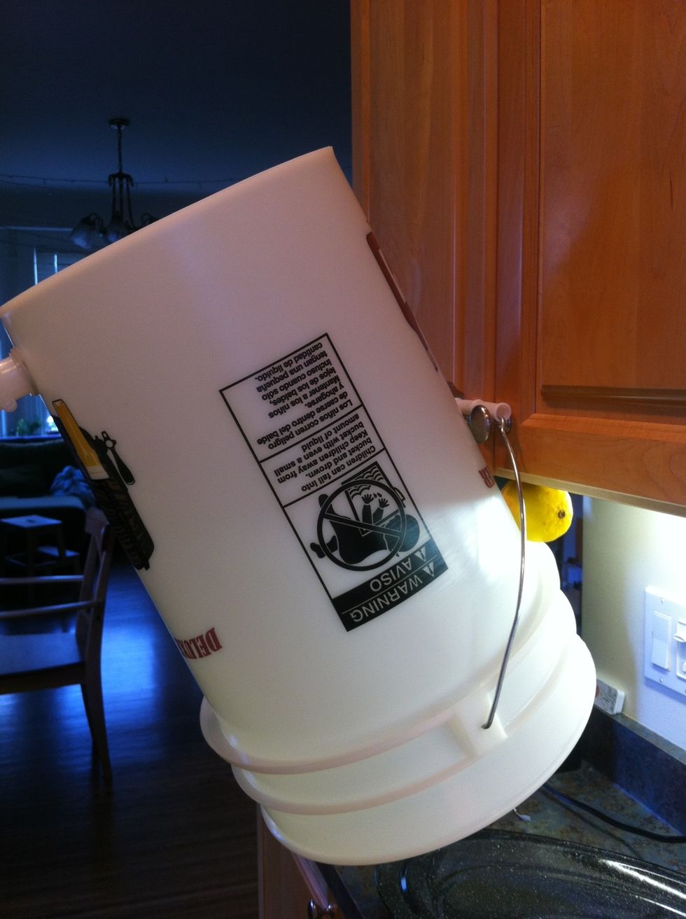 now fill your sanitized primary fermenter with 2.5 gallons of cold water. dump 1/3 of your cooled beer in and add your yeast. then pour the rest on top. DO NOT stir it. Yeast does not need your help.