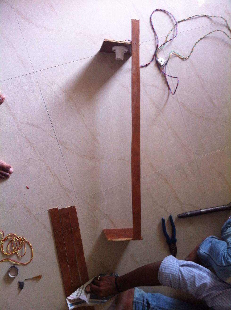 Now fix the other square board on the top of the strip. Take precaution that strip should be fixed straight once you fix this with nails you can not undone it.