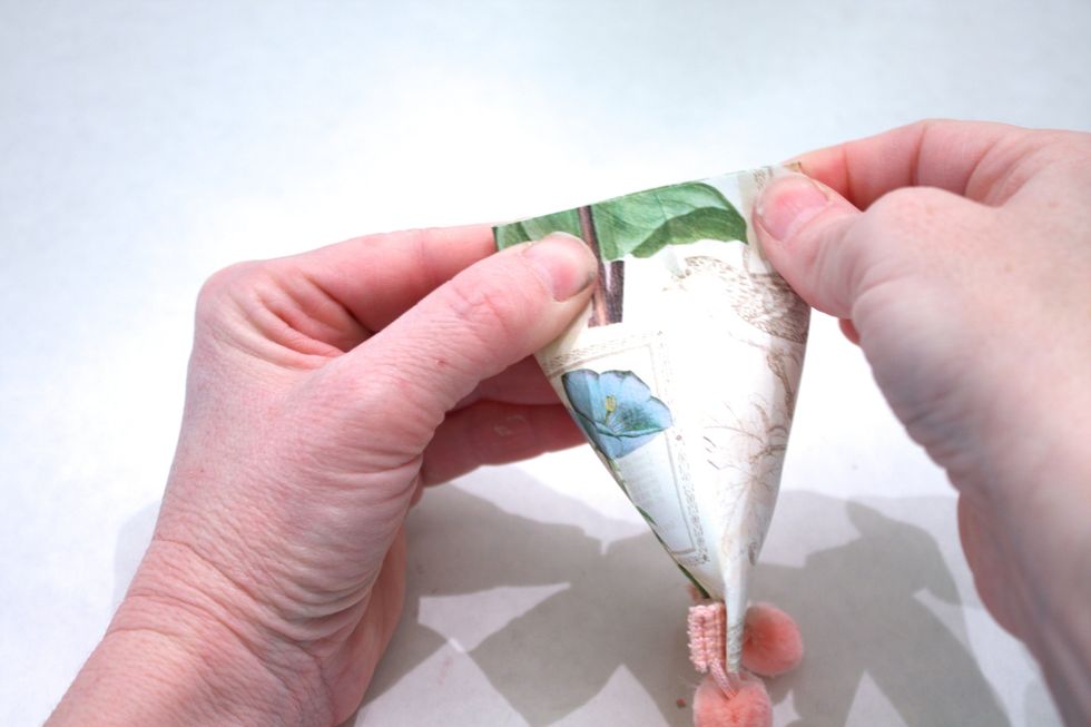 Now flatten out the roll on the opposite side, in the opposite direction