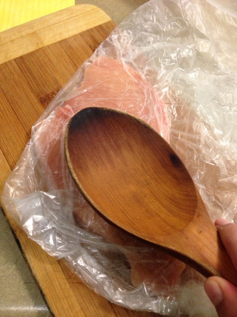 Now flatten the chicken cutlet to 1/4 inch thickness with kitchen hammer. I used wooden spoon instead.