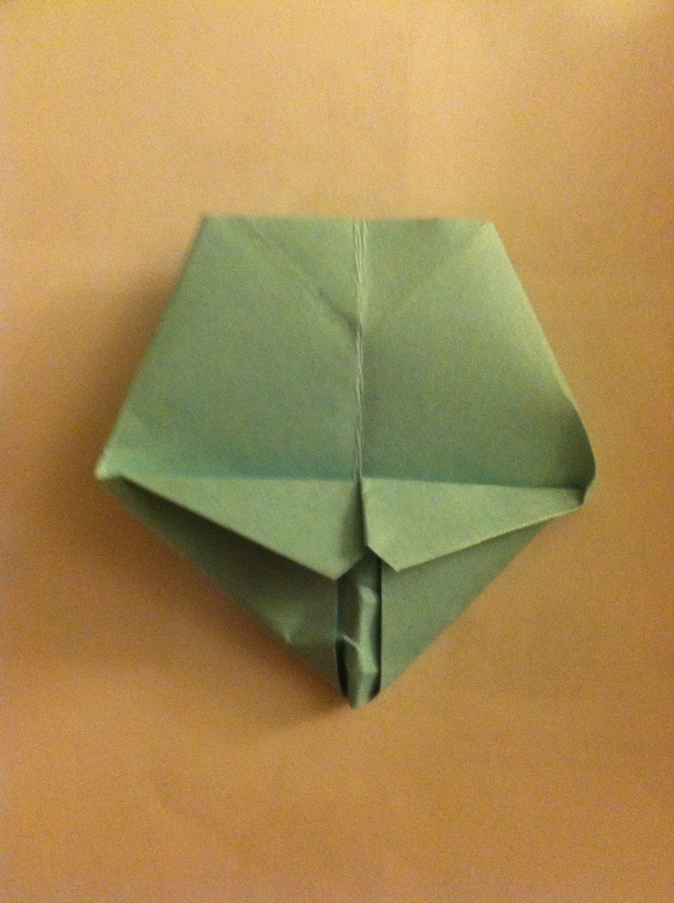 Now flatten the pointed piece, be careful not to tear the paper.