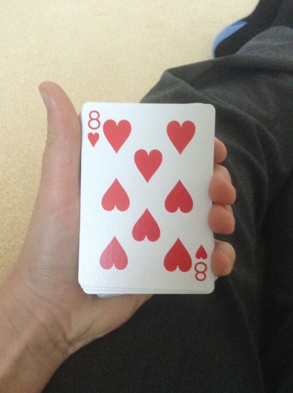 Now flip over the top card and amaze them all! Before you flip over the top card, build it up or say some 'magic words'. Just do it in your style!