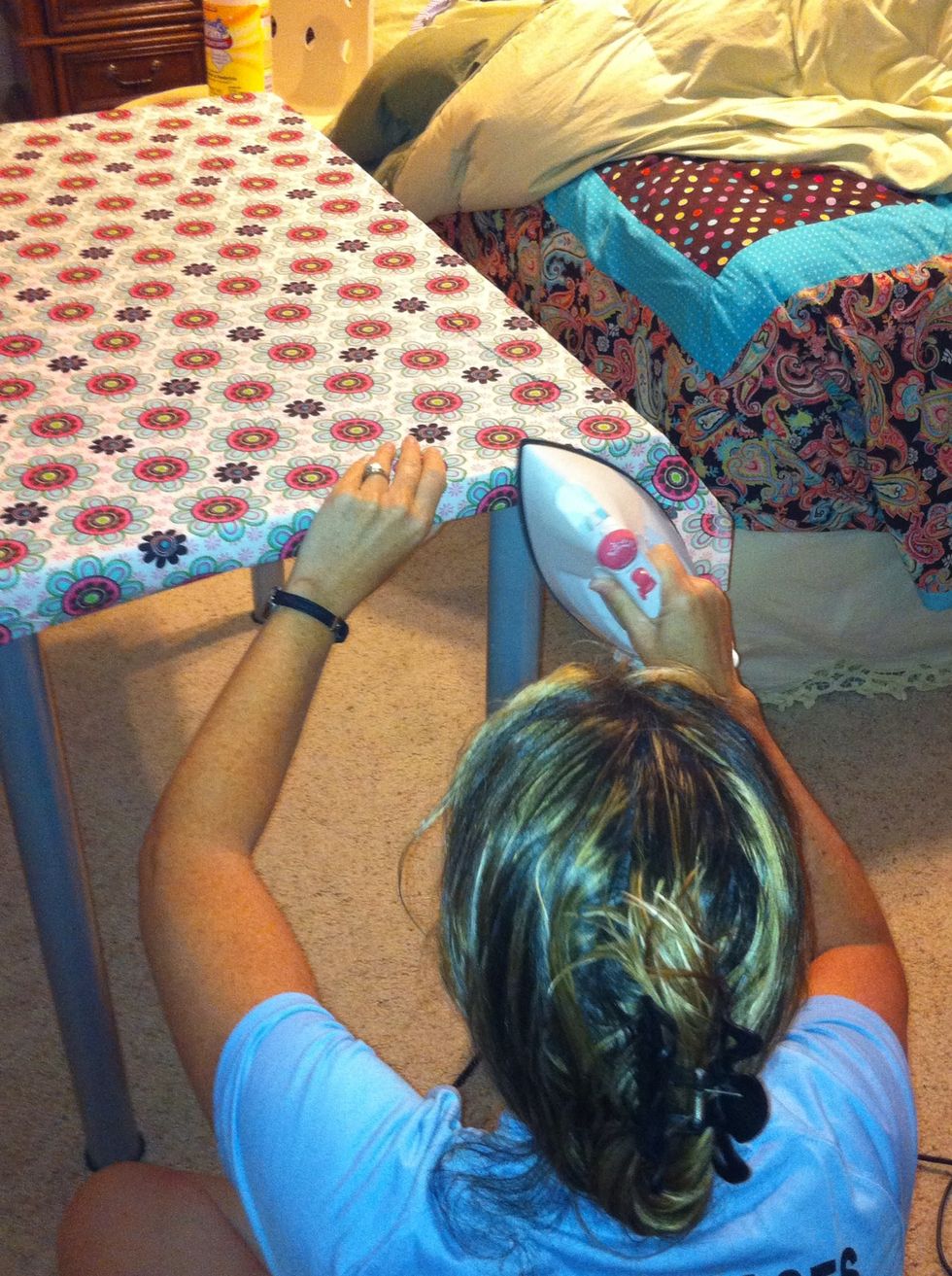 Now flip the fabric over and position it where you want it. Make sure all corners are covered before you start ironing! And start ironing on the side with the least amount if fabric!