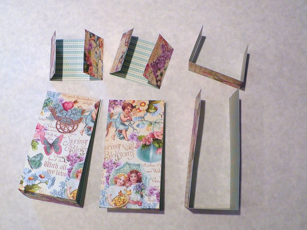 Now fold as shown at the scores. The scores higher up on the larger pieces do not need to be folded at this point, they just help the box bend later.