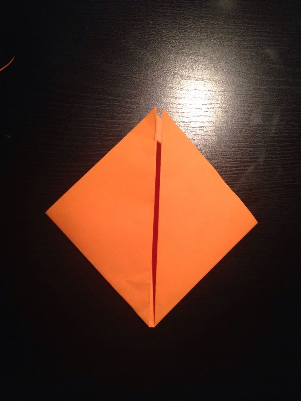 Now fold both the right and left corners to the top.