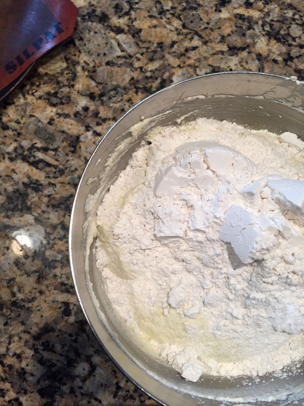 Now, fold in the dry ingredients: 3 1/4 cups of cake flour, 1/4 tsp salt and 1/4 tsp baking soda. Mix this by hand until it is pillowy and combined