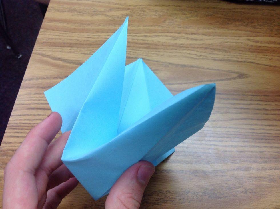 Now fold in the sides, and make sure to follow the crease in the paper as a guideline. Then fold the remaining side just as you did.