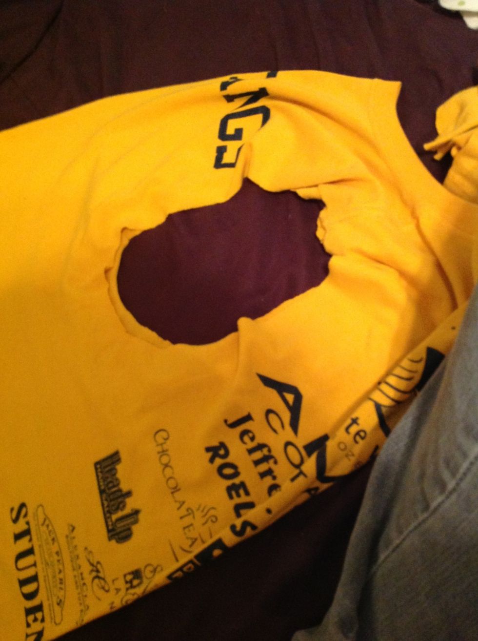 Now fold it back in half so the two holes that the sleeves used to be match up