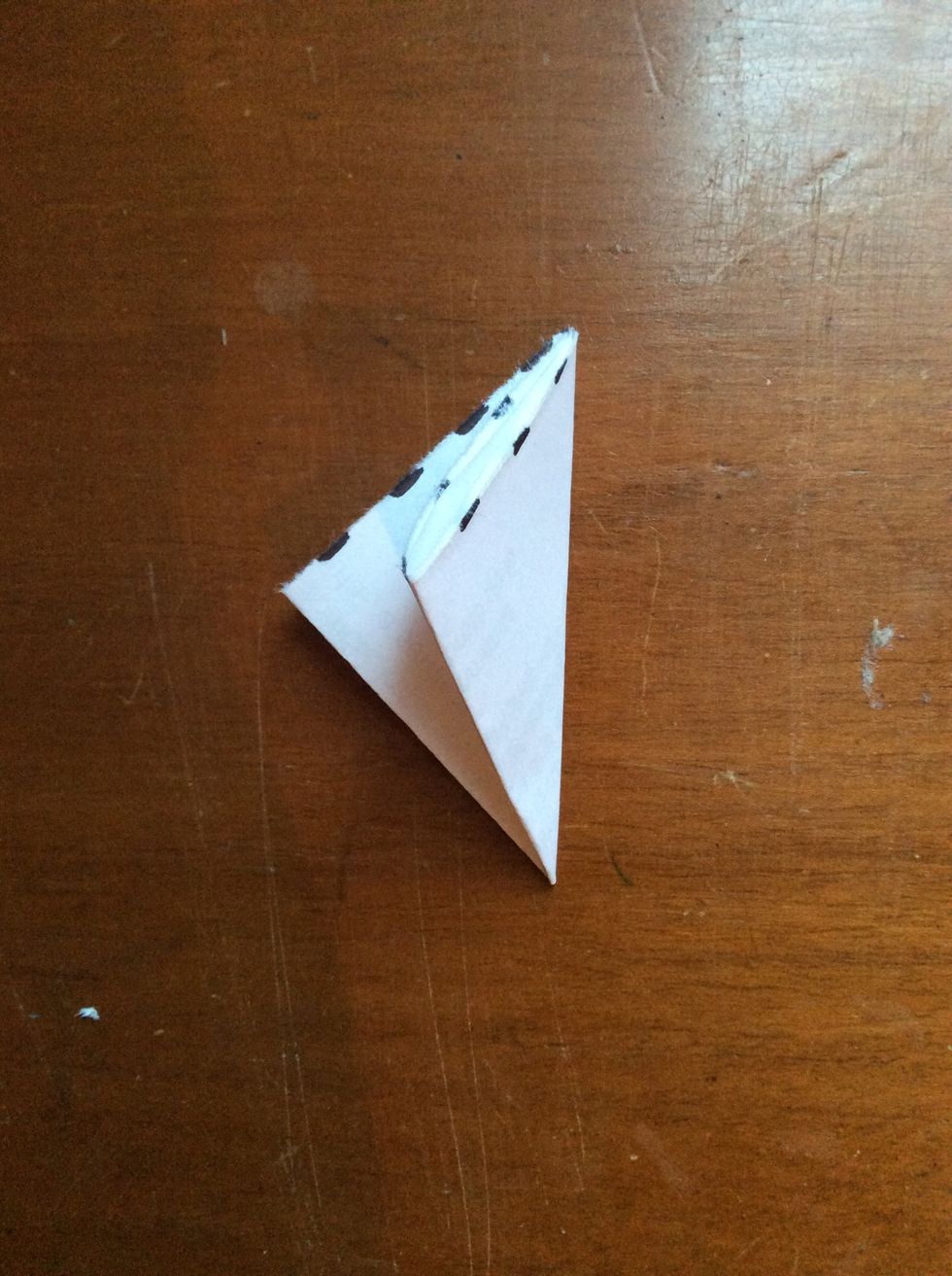 Now, fold it diagonally to make a triangle.