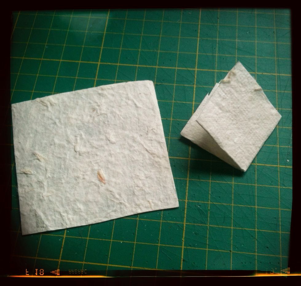 Now fold it over again so you end up with a little square.