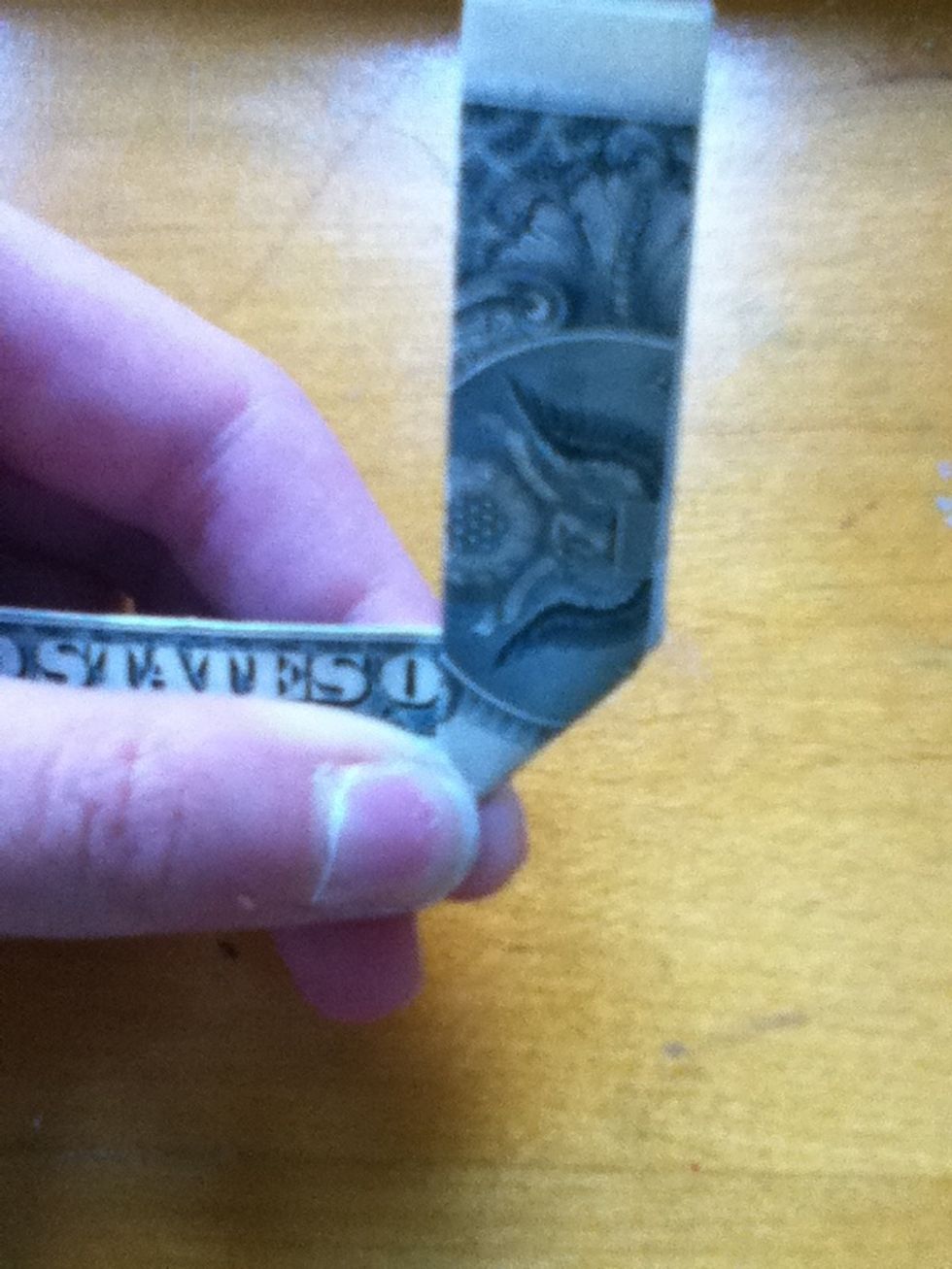 Now fold it up just covering the f.