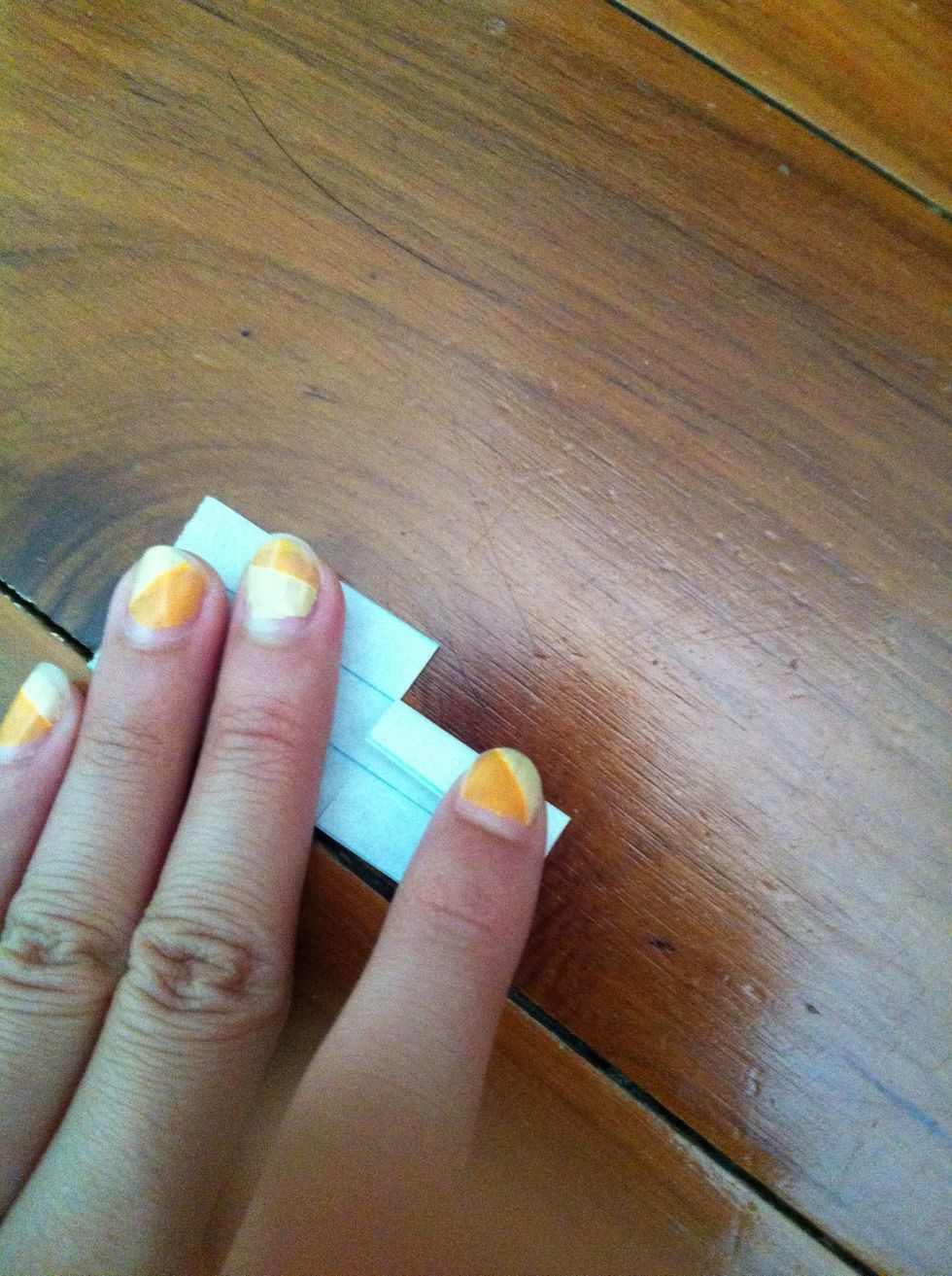 Now fold one of the flaps on the bottom ( the shorter side)