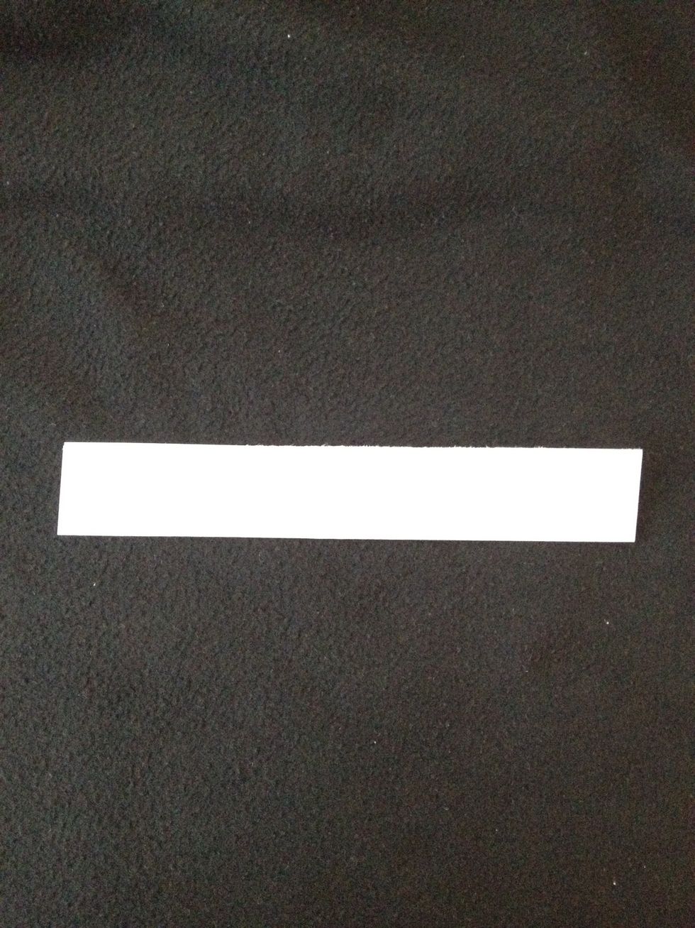 Now fold one of those pieces in half so that it looks like this.