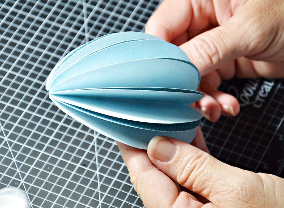 Now fold out each half of the egg.