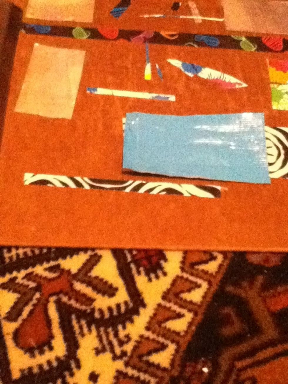 Now fold over that little sticky part, so there isn't anymore sticky sides showing.And then cut a thin strip of tape from the other piece.